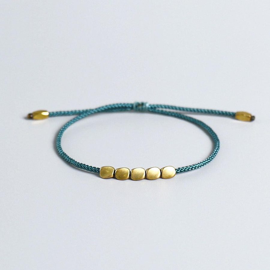 Bracelet de chance tibétain et perles de cuivre
