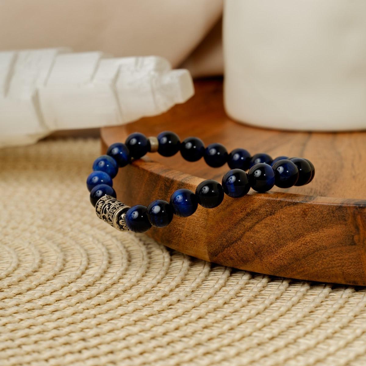 Bracelet Perles de pierres d'Œil de tigre bleu et totem bouddhiste