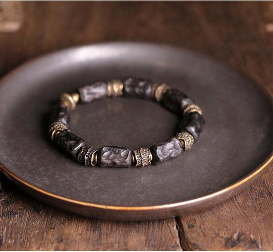 Bracelet en bois d’ébène et cuivre martelé