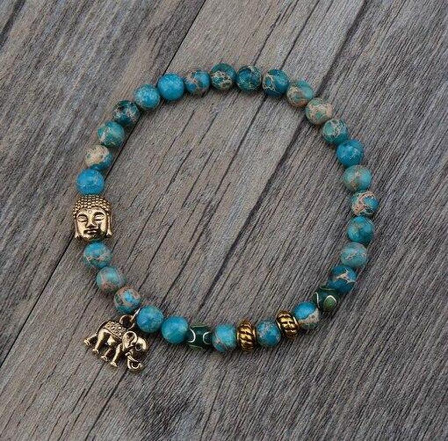 Bracelet en perles de Turquoise et symboles sacrés