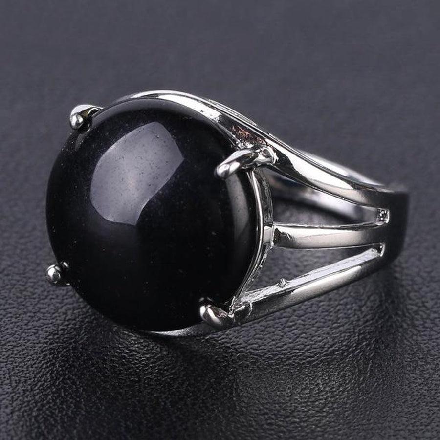 Bague cabochon en pierre sertie griffes