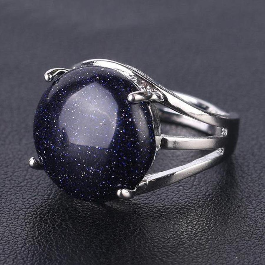 Bague cabochon en pierre sertie griffes
