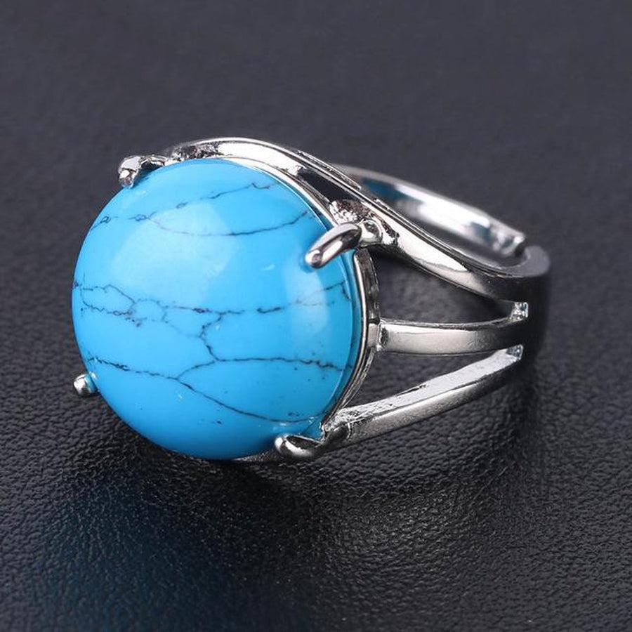 Bague cabochon en pierre sertie griffes