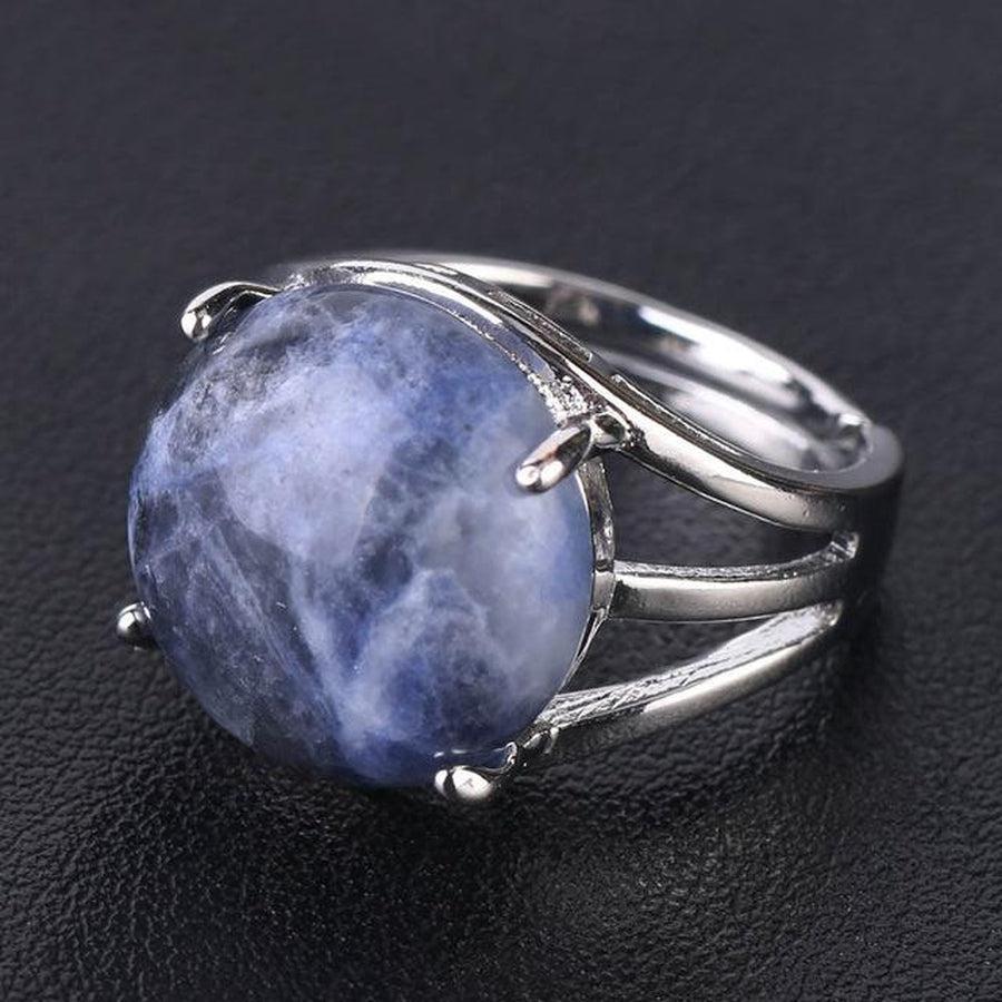 Bague cabochon en pierre sertie griffes