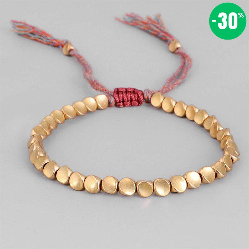 Bracelet bouddhiste en perles de cuivre et cordon coloré