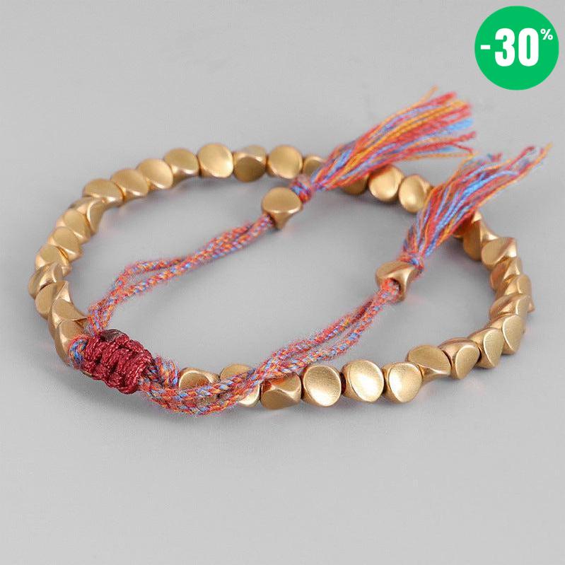 Bracelet bouddhiste en perles de cuivre et cordon coloré