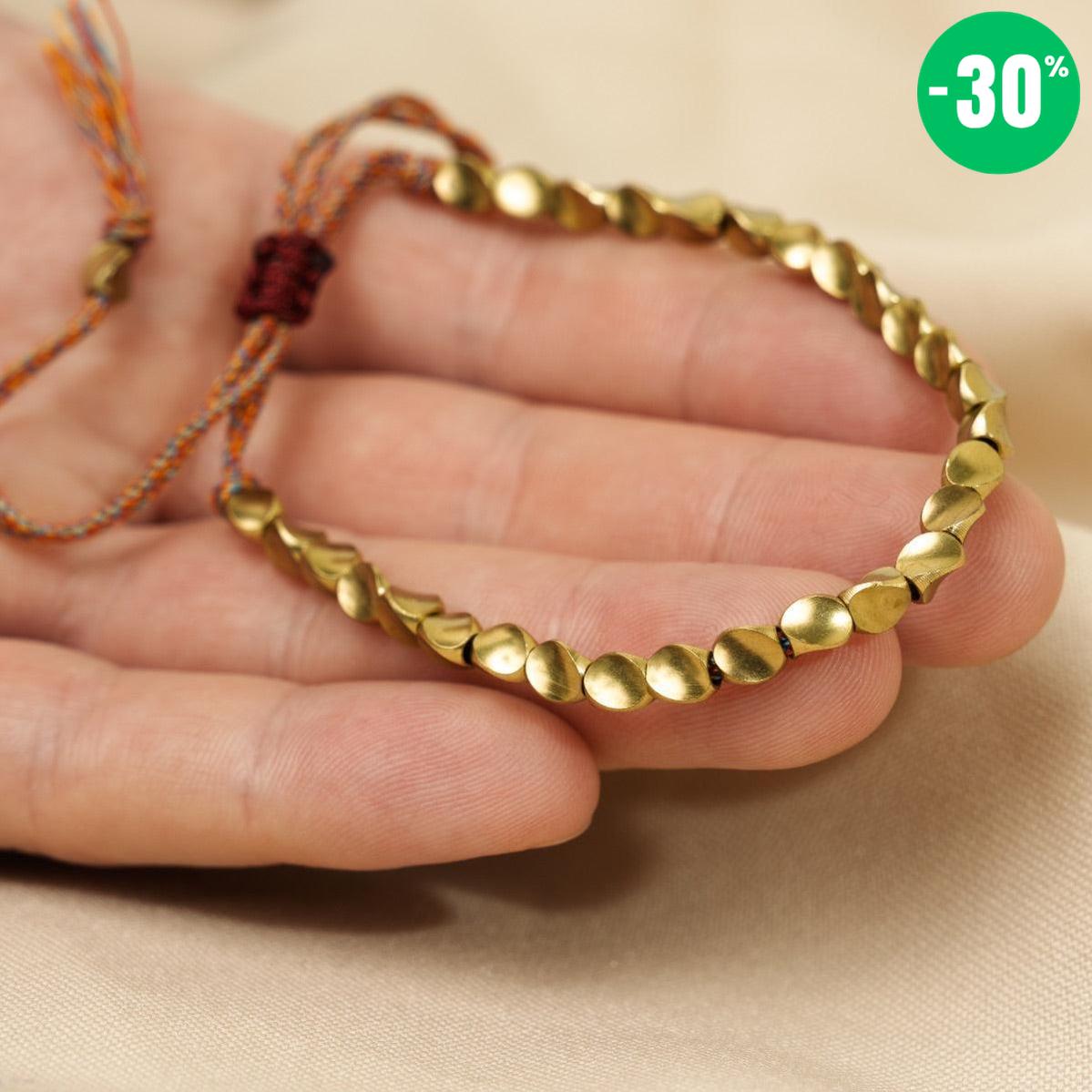 Bracelet bouddhiste en perles de cuivre et cordon coloré