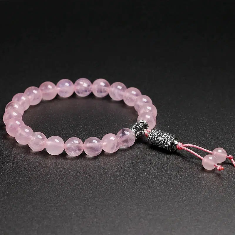 Bracelet en Quartz rose et perle centrale mantra « Om »