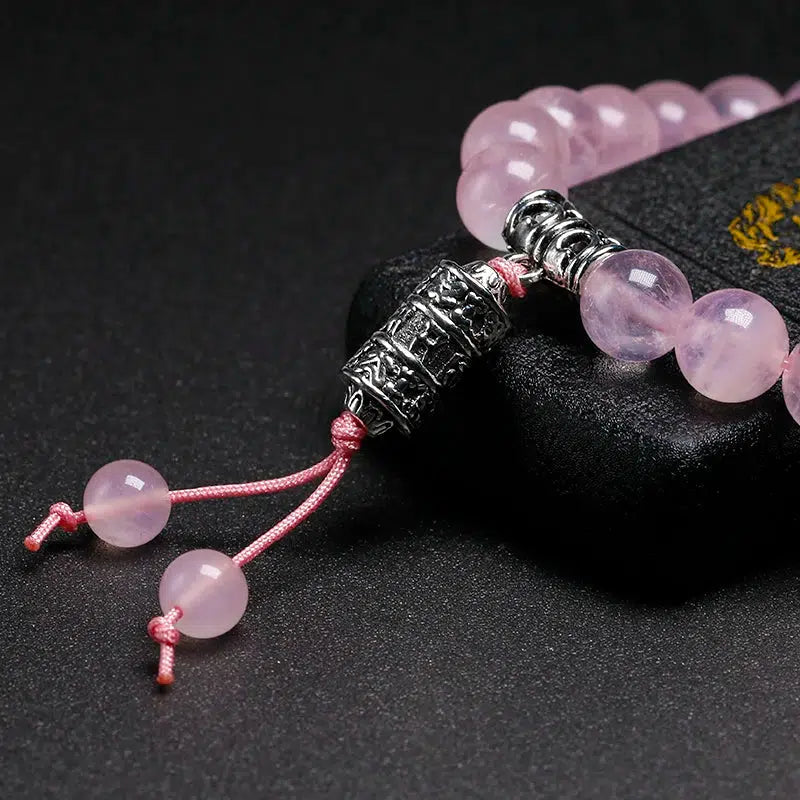 Bracelet en Quartz rose et perle centrale mantra « Om »