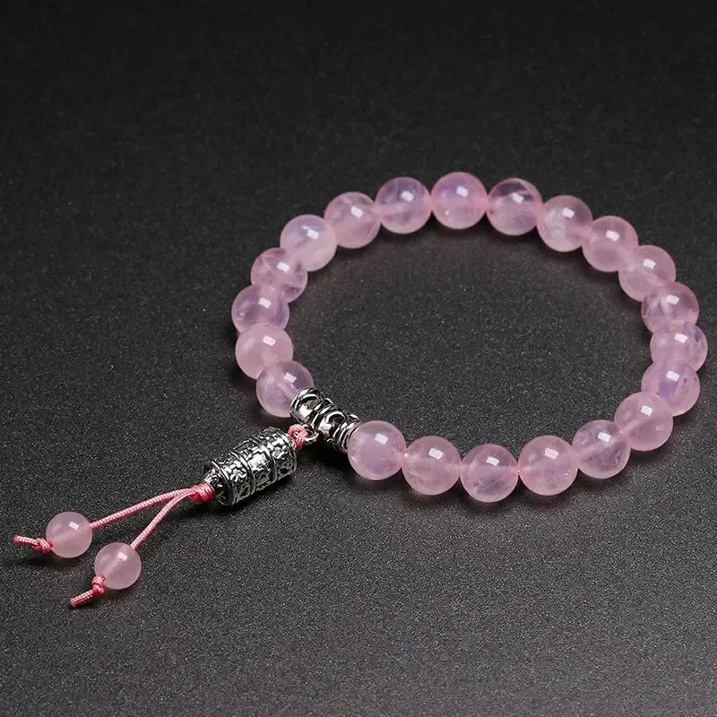 Bracelet en Quartz rose et perle centrale mantra « Om »