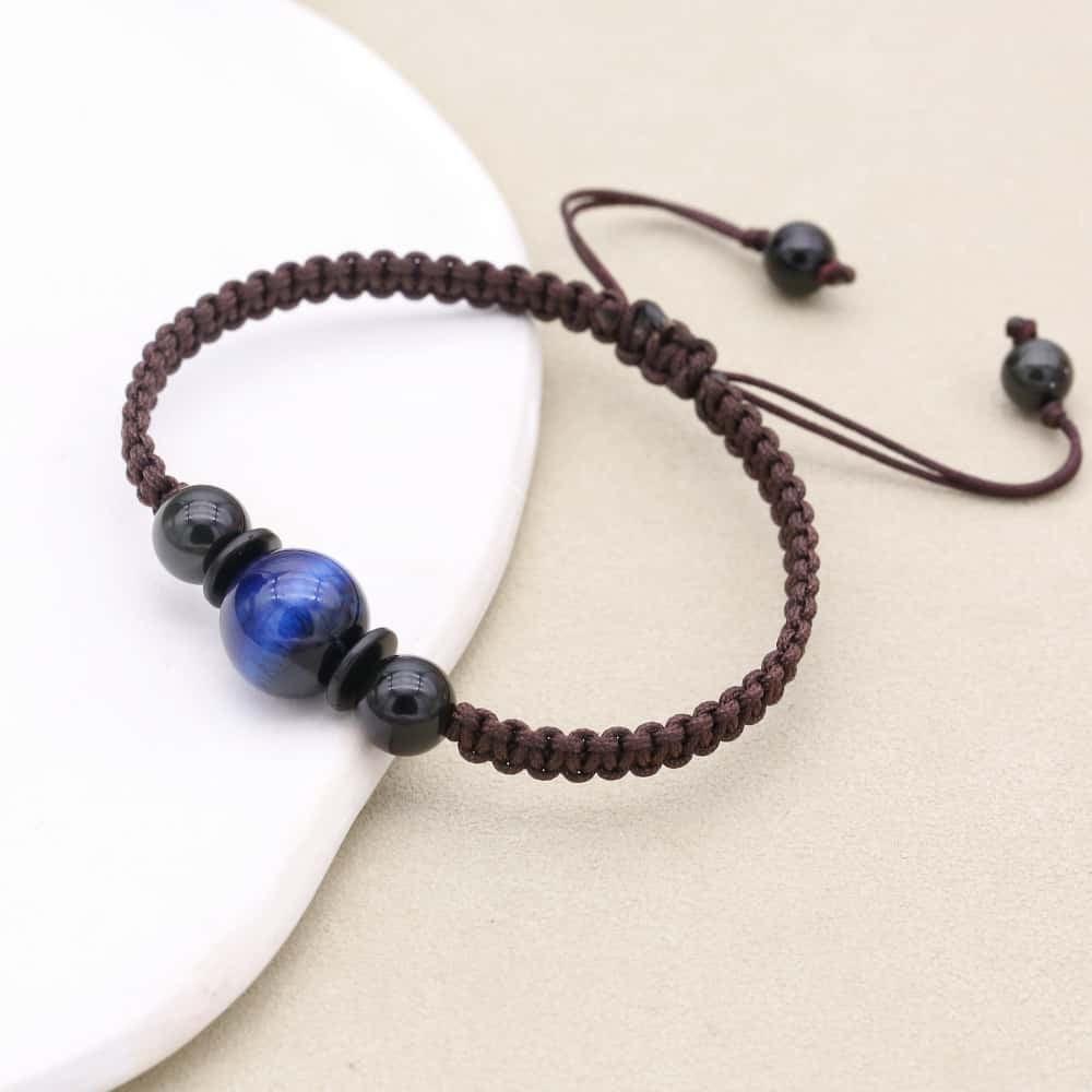 Bracelet Shamballa Œil de tigre bleu sur cordon tissé