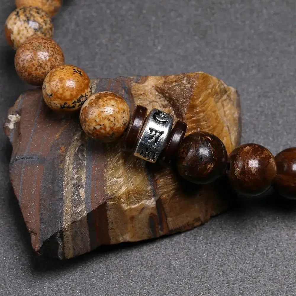 Bracelet tibétain en perles de pierre de Bronzite et coquille de noix de coco