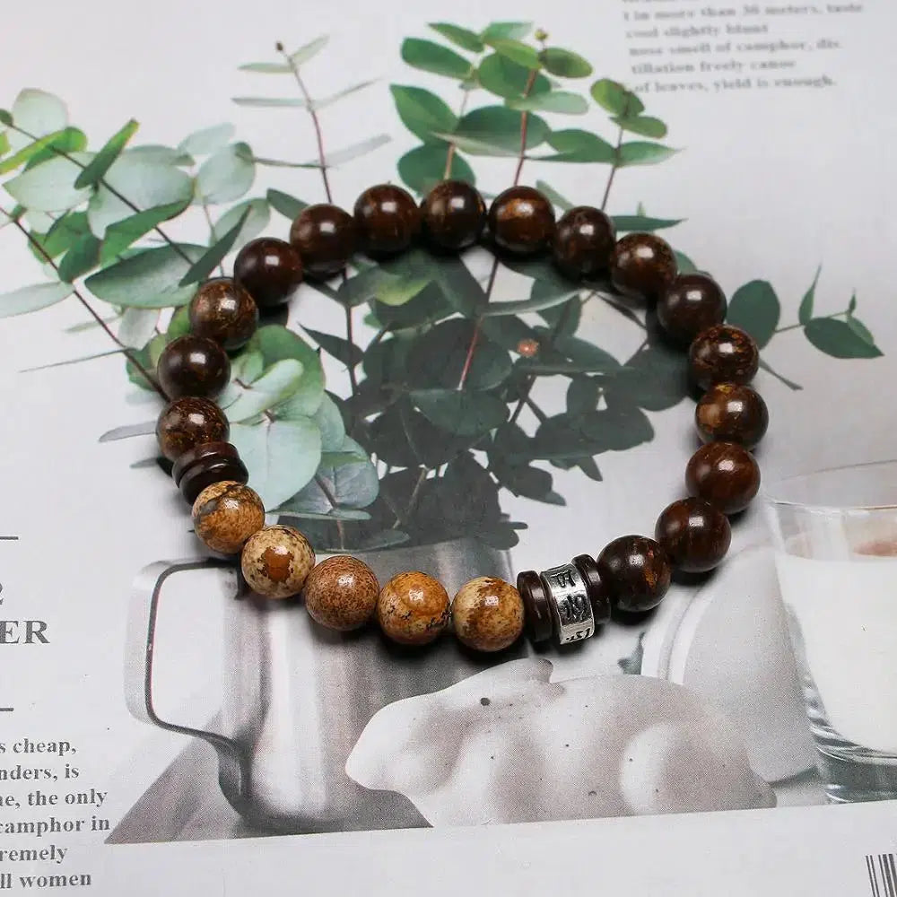 Bracelet tibétain en perles de pierre de Bronzite et coquille de noix de coco