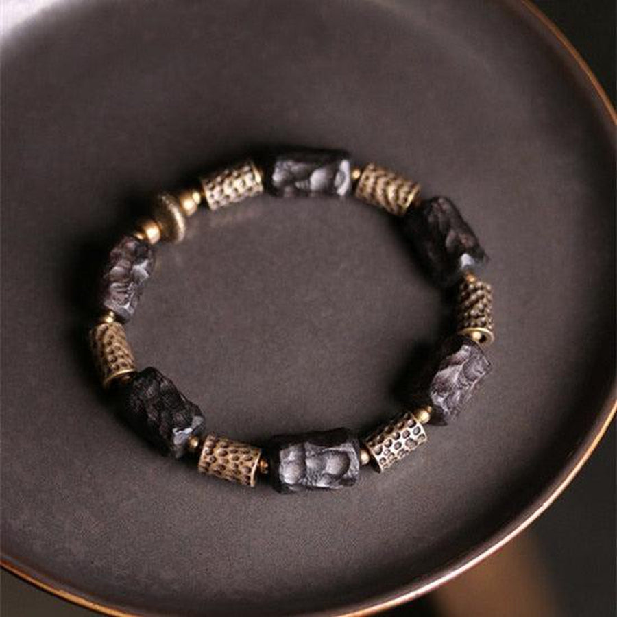 Bracelet en bois d’ébène et cuivre martelé