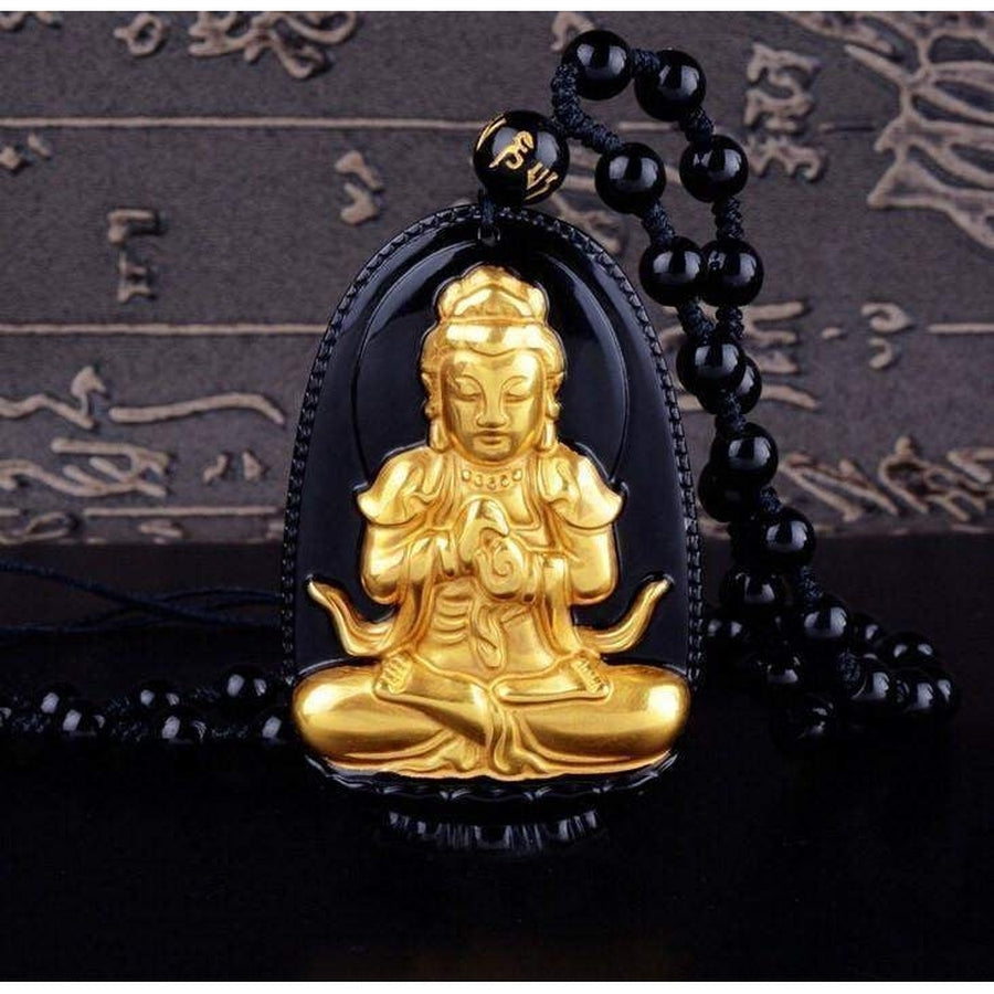 Amulette plaquée or 18 carat sur pierre d'obsidienne noire
