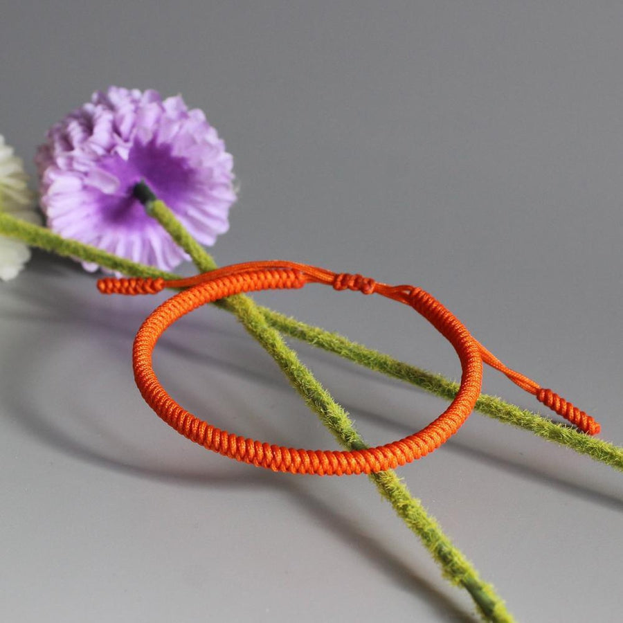 Bracelet de chance bouddhiste en corde tressée orange