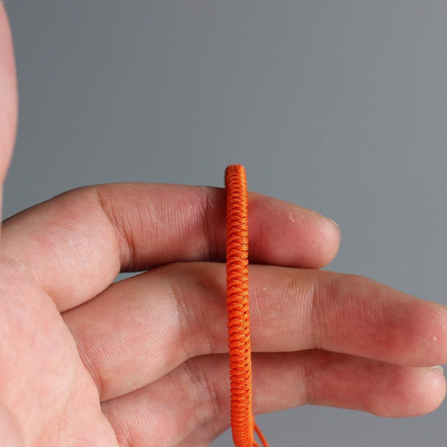 Bracelet de chance bouddhiste en corde tressée orange