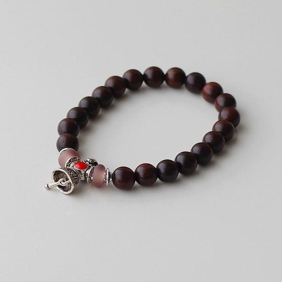 Bracelet de chance en bois avec charme cloche