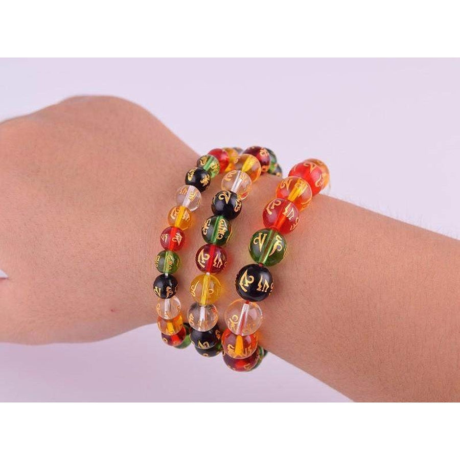 Bracelet energie en perle de verre Om Mani Padme Hum