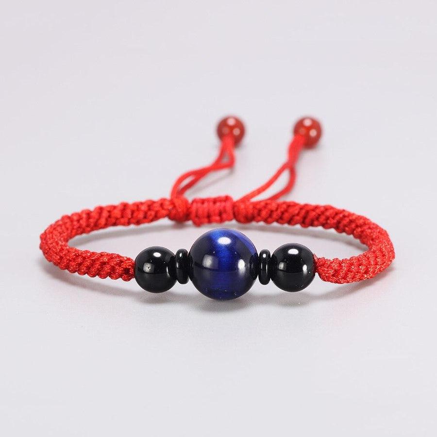 Bracelet Shamballa Œil de tigre bleu sur cordon tissé