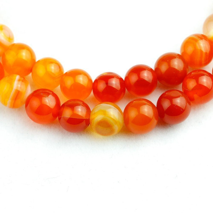 Mala en perles d’Onyx marbre orange avec charme spirituel